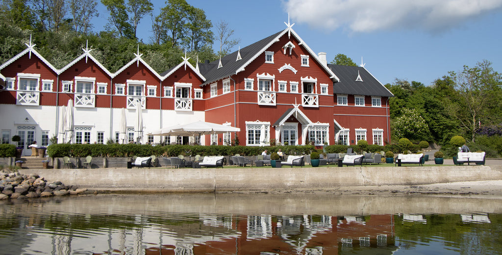 Danish Hotel, Dyvig Badehotel. A red white building with a tradition and historical look. With view over the water