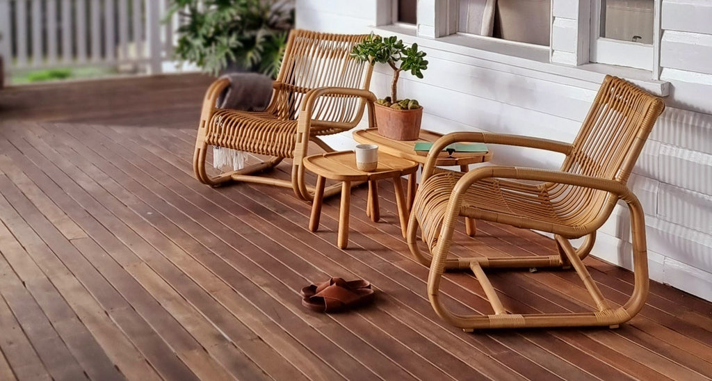 Two Curve lounge chairs on the veranda with Royal side tables in teak 