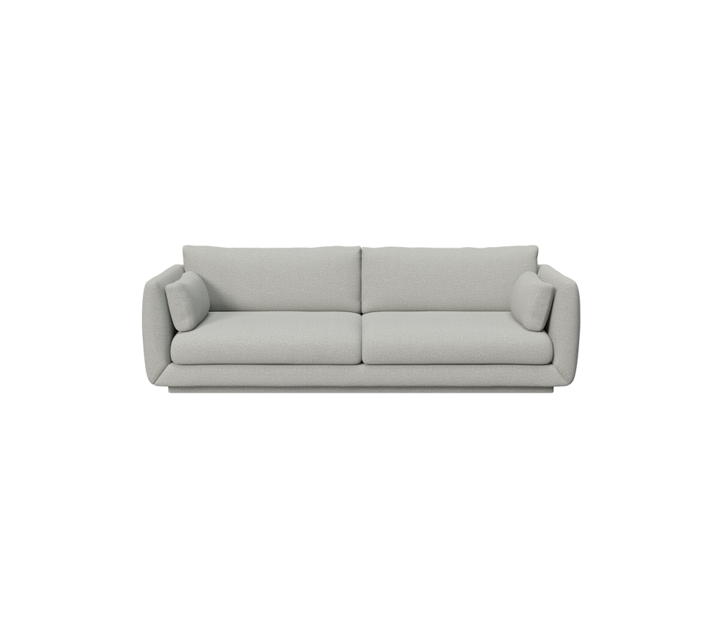 Light grey modern sofa with round cushions.