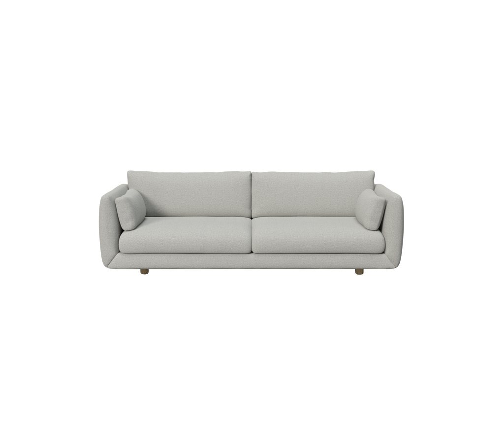 Light grey modern sofa with round pillows.
