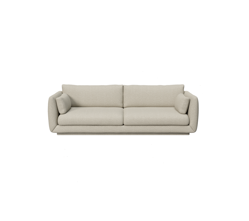 Light brown modern sofa with rounded edges and cushions.
