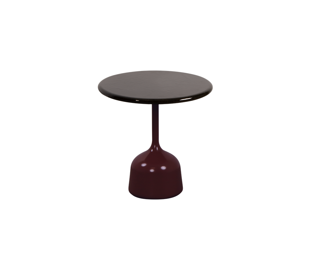 Burgundy and black round table with a unique base design.