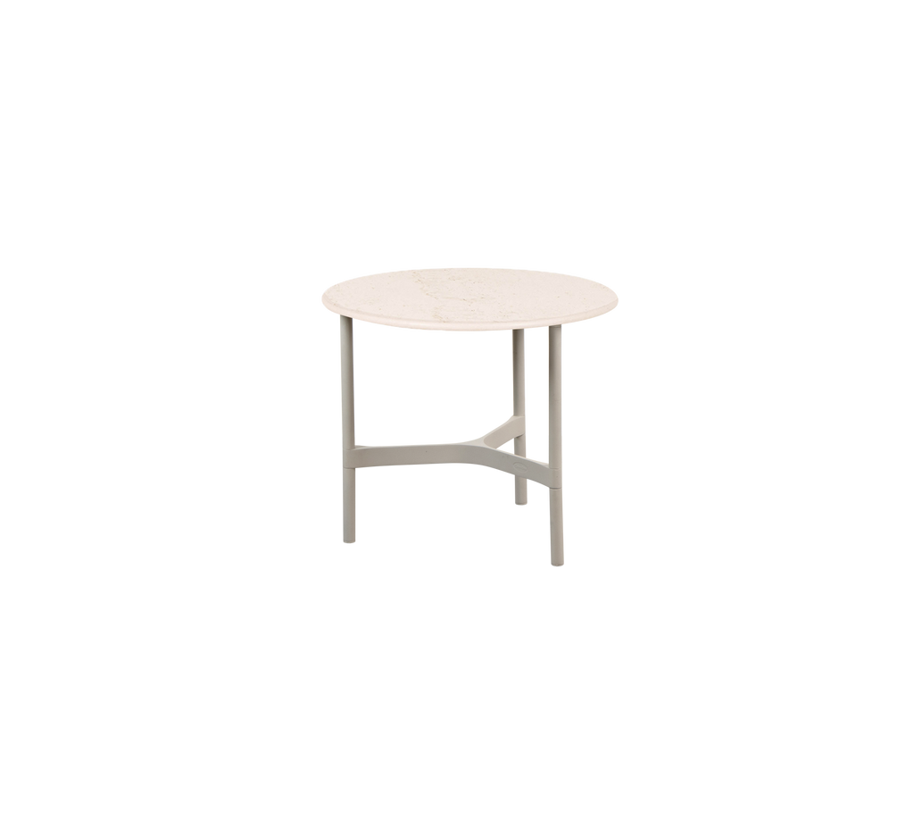 Round table with a light-colored surface and a minimalist design, featuring four sturdy legs. Perfect for various settings and uses.