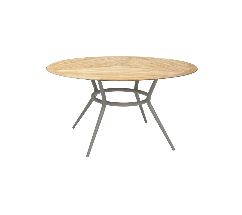 Taupe round table with a simple design and sleek legs.