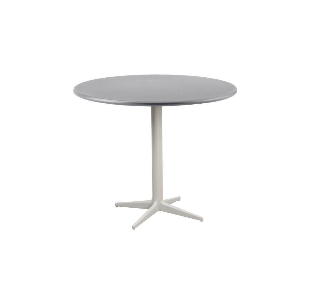 Modern round table with a smooth gray top and a sturdy, light-colored base featuring a four-legged design.
