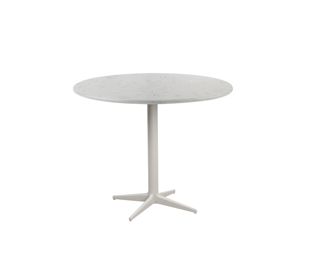 Round table with a simple design and a white base.