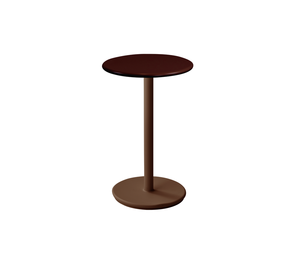 Round table in desert red color with a simple design.