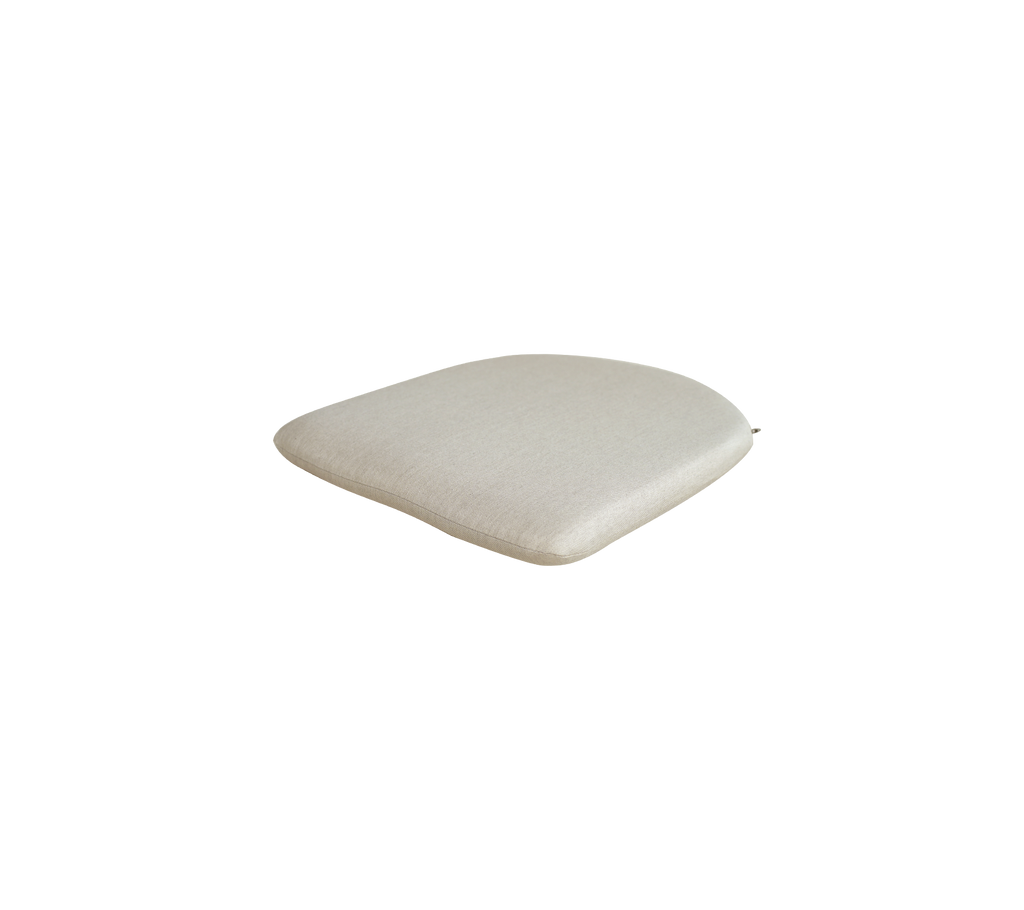 Sand-colored cushion with a smooth, rounded shape.