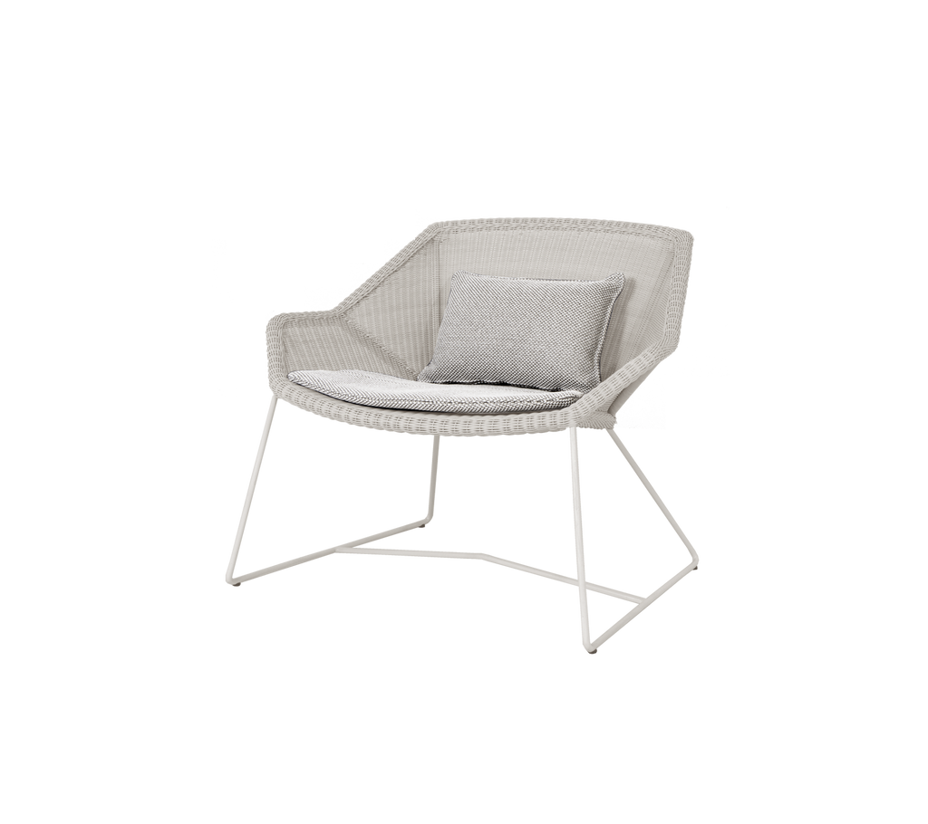 Light grey chair with a matching cushion in a modern design.