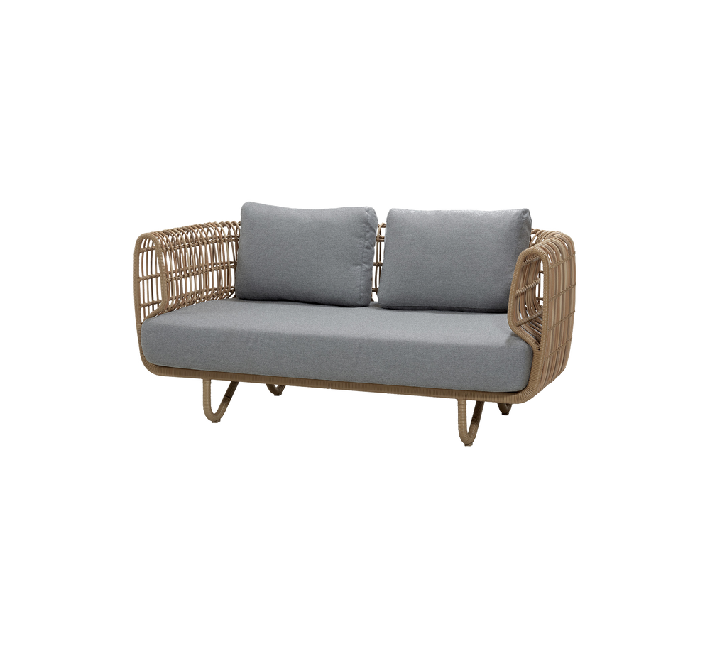 Natural sofa with grey cushions in a modern lounge setting.