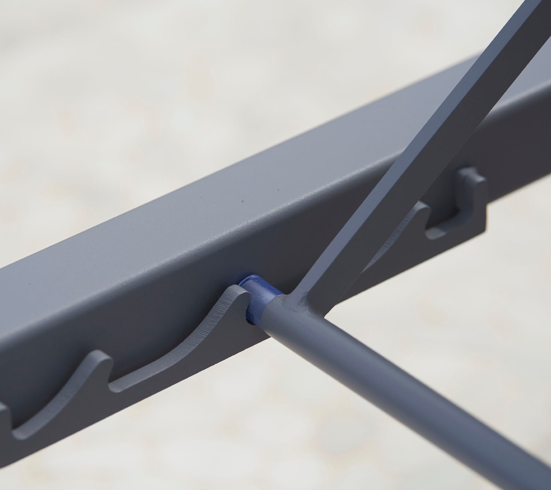 Close-up of a sturdy, gray metal frame featuring intricate design elements for added stability and support.