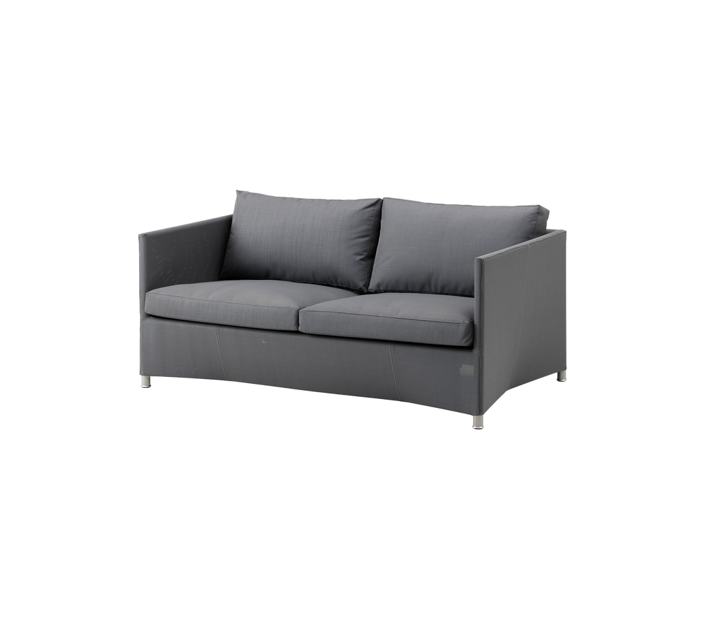 Modern grey sofa with cushions in a contemporary setting.
