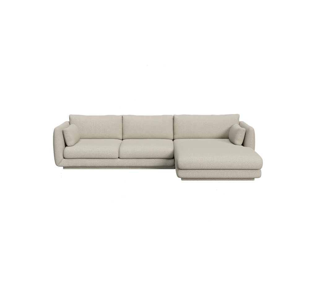 Light brown sectional sofa with a minimalist design.