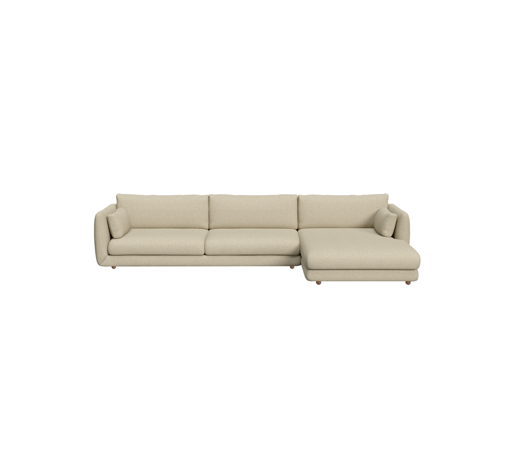 Light brown modern sectional sofa in a contemporary lounge setting.
