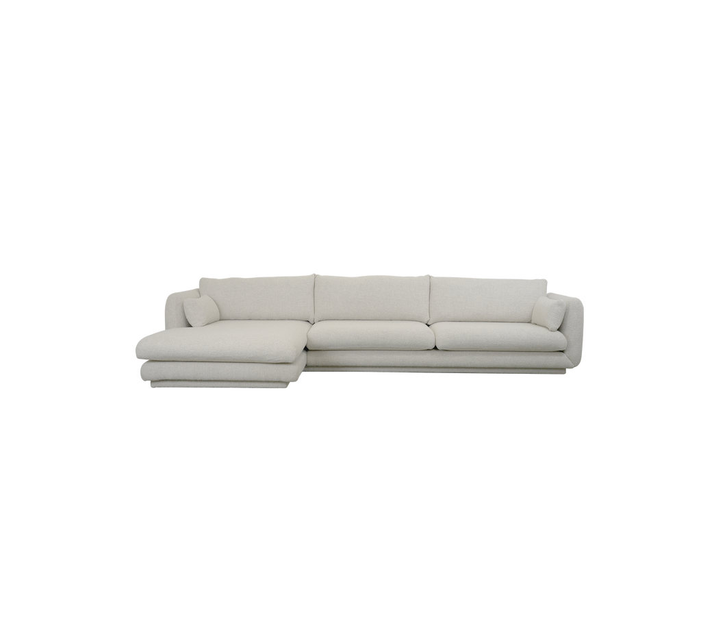Modern sand sofa with a sectional design and plush cushions.