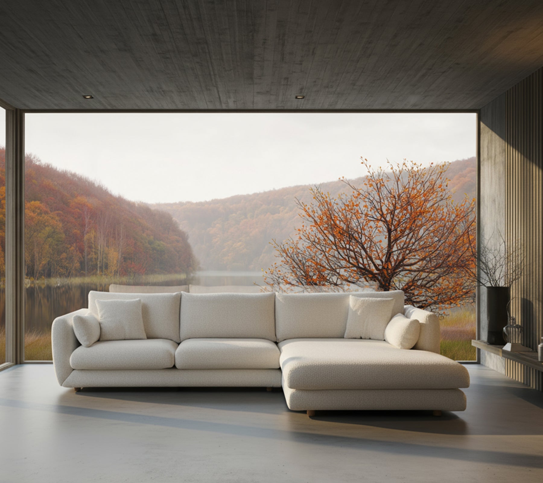Modern white sectional sofa in a lounge with a scenic view.