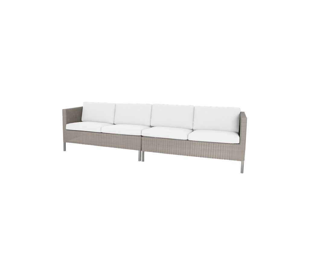 Stylish sofa with a woven base and plush white cushions, perfect for enhancing any dining space.